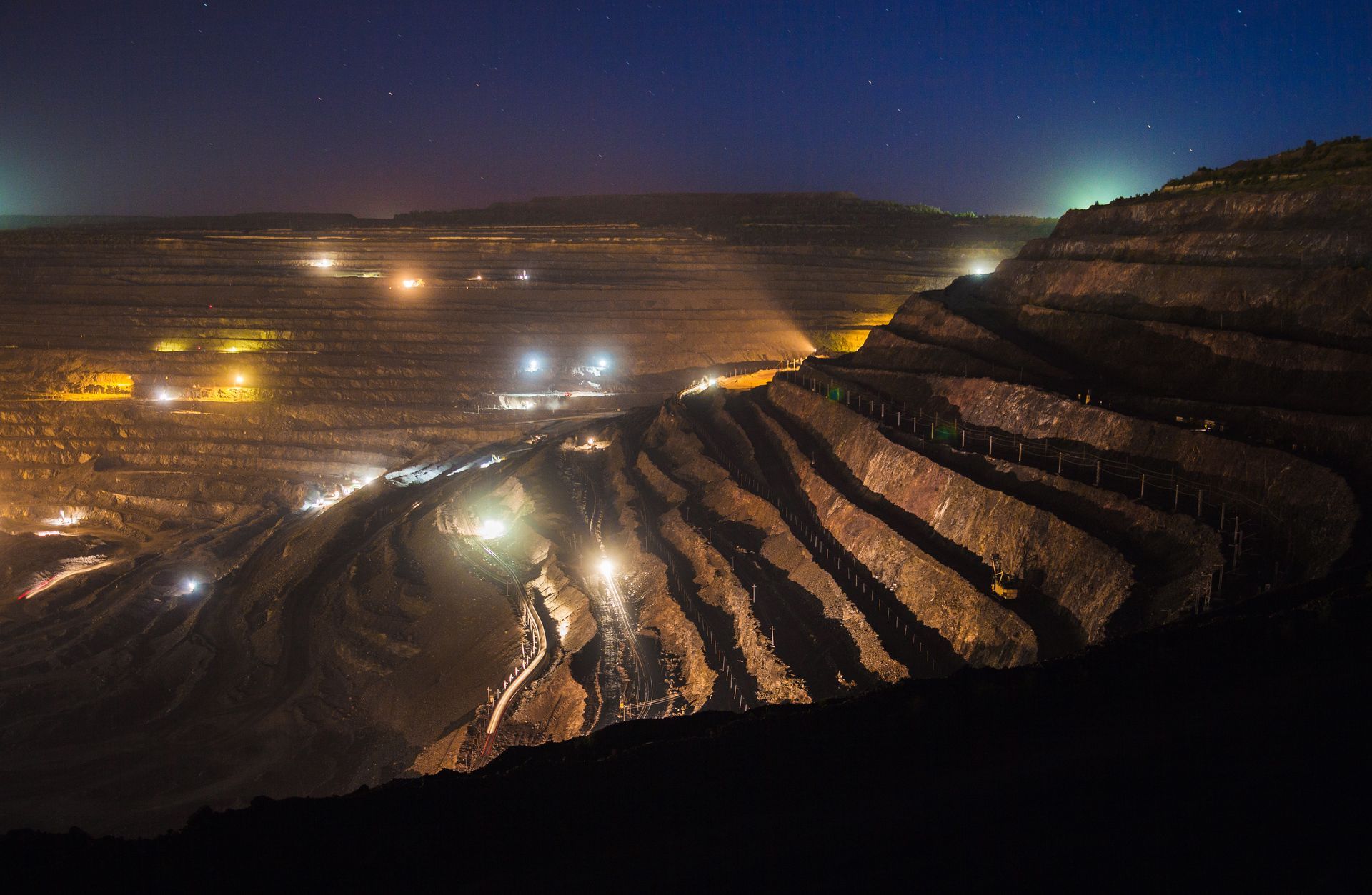 Aerial view of a mining pit at night